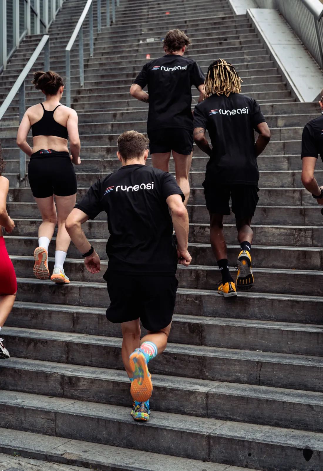 Runners climbing outdoor stairs